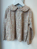 Camicia rosa, beige e marrone