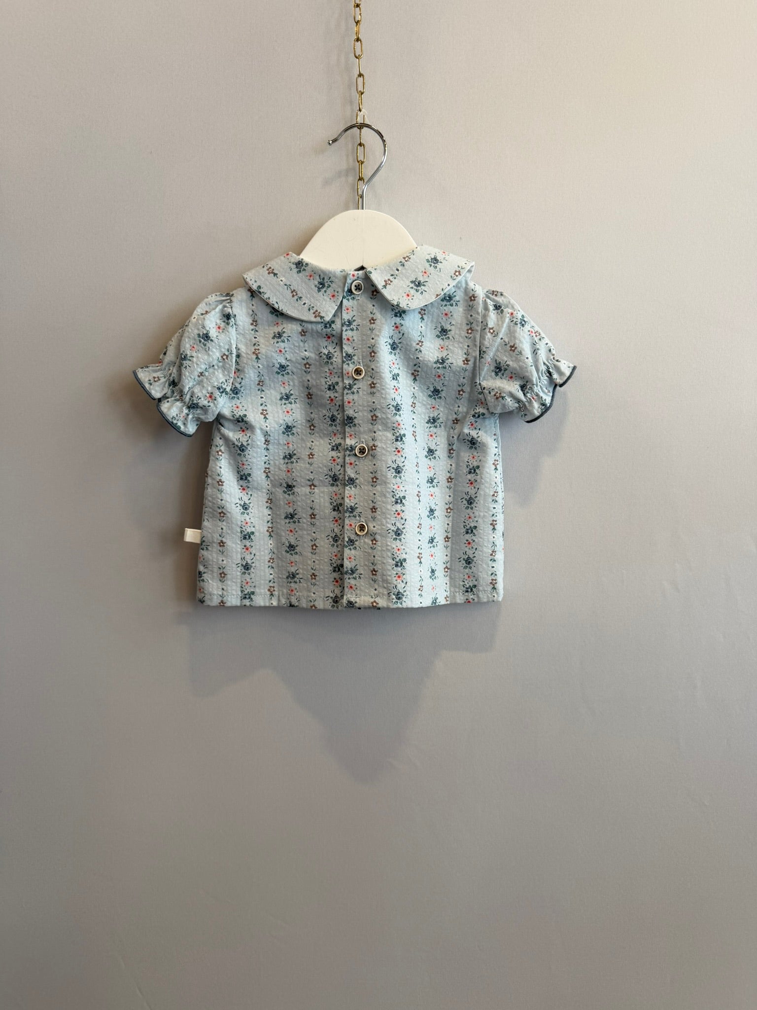 Camicia azzurra fiorellini