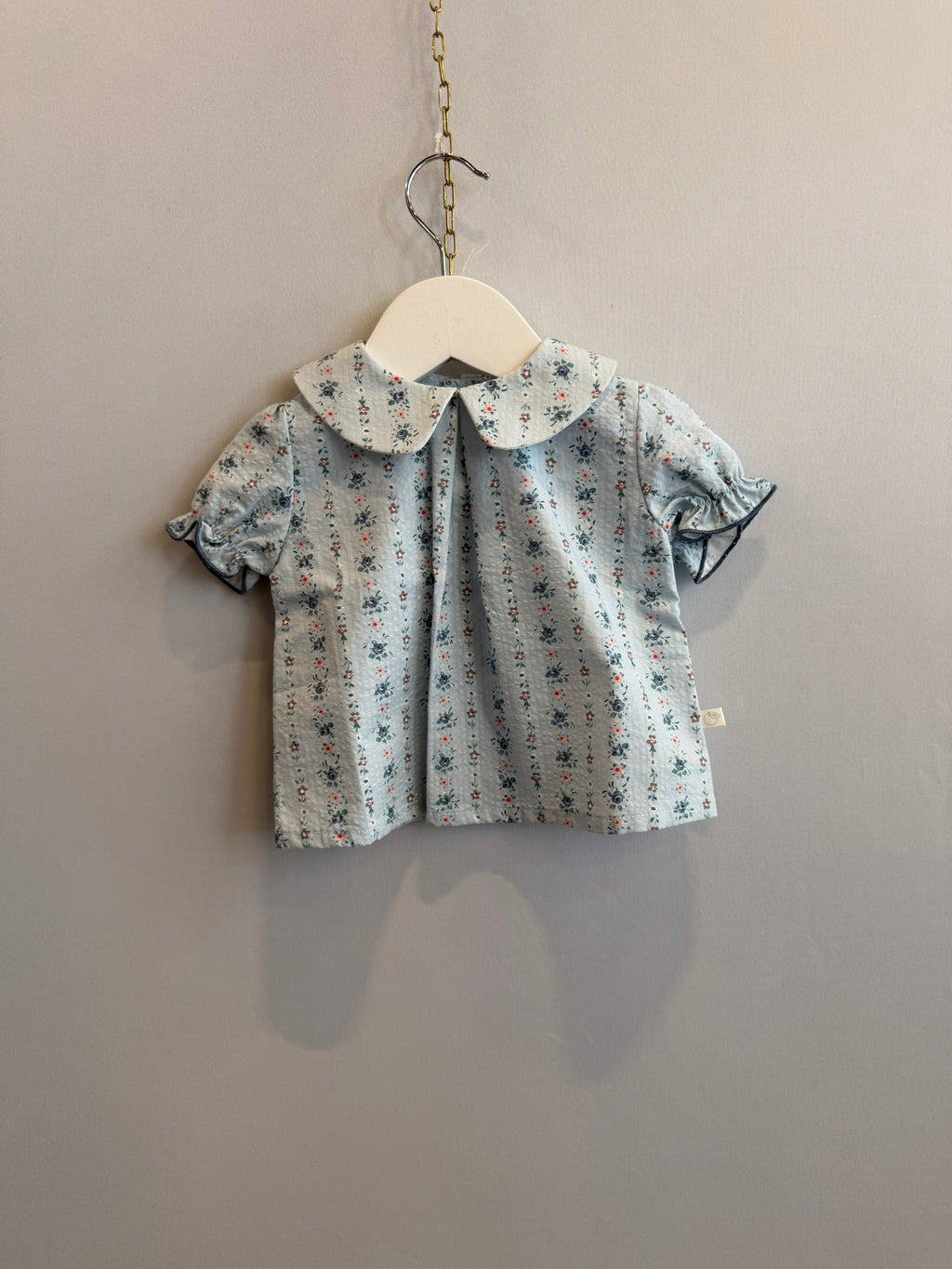 Camicia azzurra fiorellini
